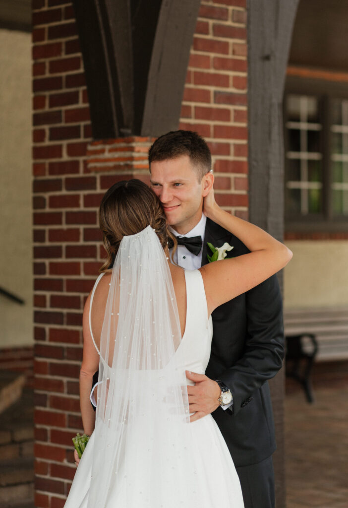 couple embracing during first look