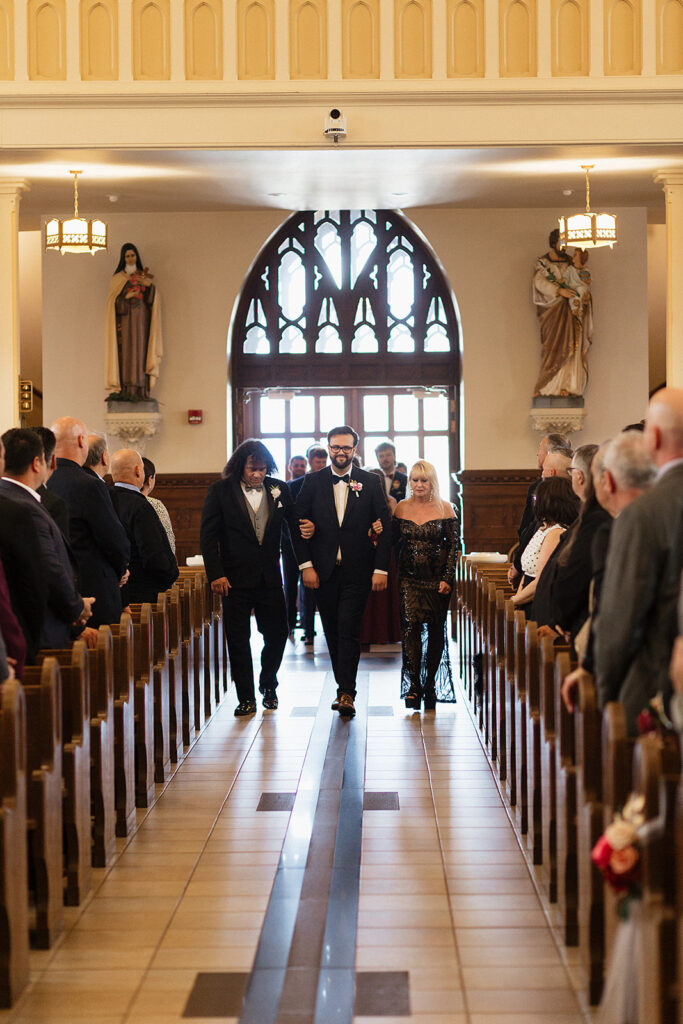 church ceremony entrance,  groom walking down the aisle