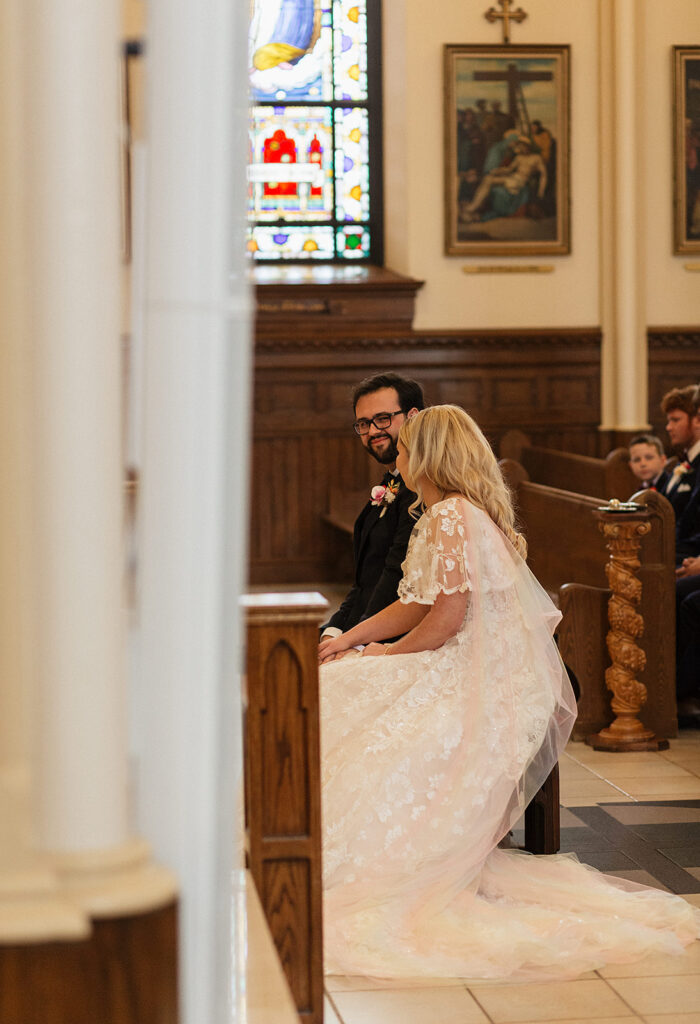 church ceremony photo, groom smiling at bride