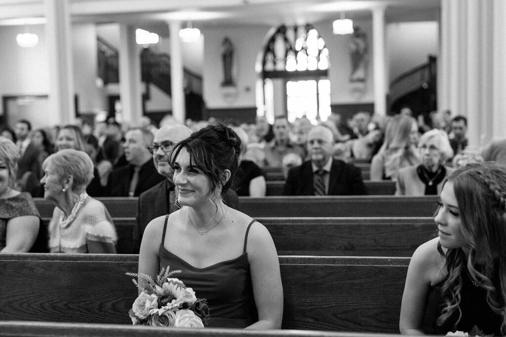 church ceremony, black and white photo, guests smiling 